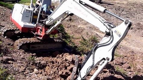 mini excavator going down steep hill|mini ex drive up slope.